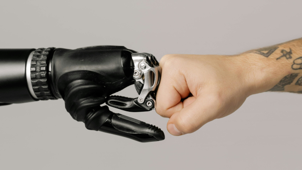 Robot and human fist bump
