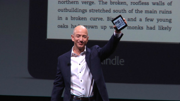 Amazon CEO Jeff Bezos holding Kindle Paperwhite