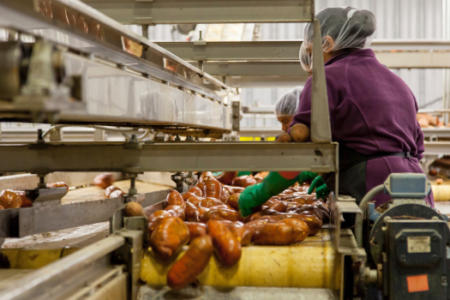 Woman cleaning sweet potatoes