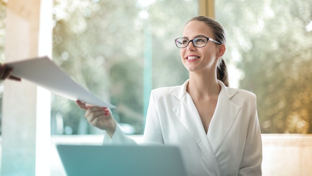 woman in an office with a laptop