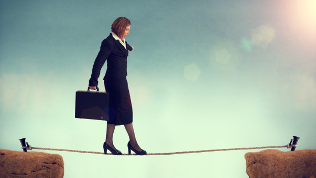 woman walking a tighrope