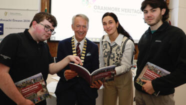 Cllr Liam Carroll, Cathaoirleach of the County of Galway and University of Galway students Dylan Reilly, Joseph Ennis and Natalie Cyrkle pictured with ‘Opening The Door To Ireland’s Heritage’, a Heritage Council publication which features their work on the ‘Galway County Heritage Trails’ project with Galway County Council