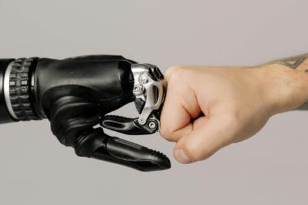 Robot and human fist bump