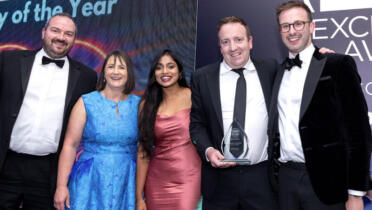 David Kelly, Chief Corporate Officer of Cubic Telecom receives the company of the year award from David Russell, Elio Networks